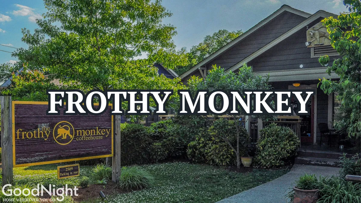 A welcoming exterior of a coffeehouse, complete with greenery and a visible entrance path, inviting guests to start their day with a peaceful morning coffee outdoors. The scene exudes a relaxed, communal vibe and hints at private moments of relaxation as well as social connection.